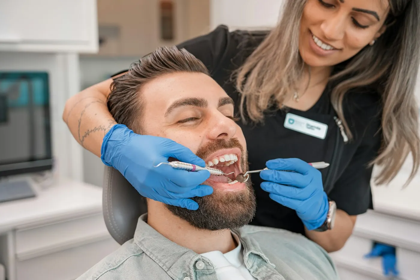 Hygienist treating a patient
